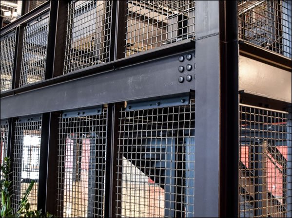 Decorative Welded Mesh Integrated into Industrial Steel Frame Wall System